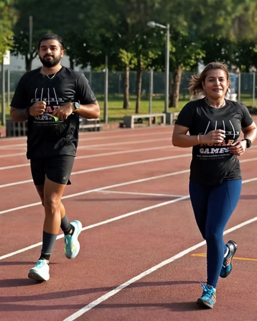 Two athletes running together, smiling