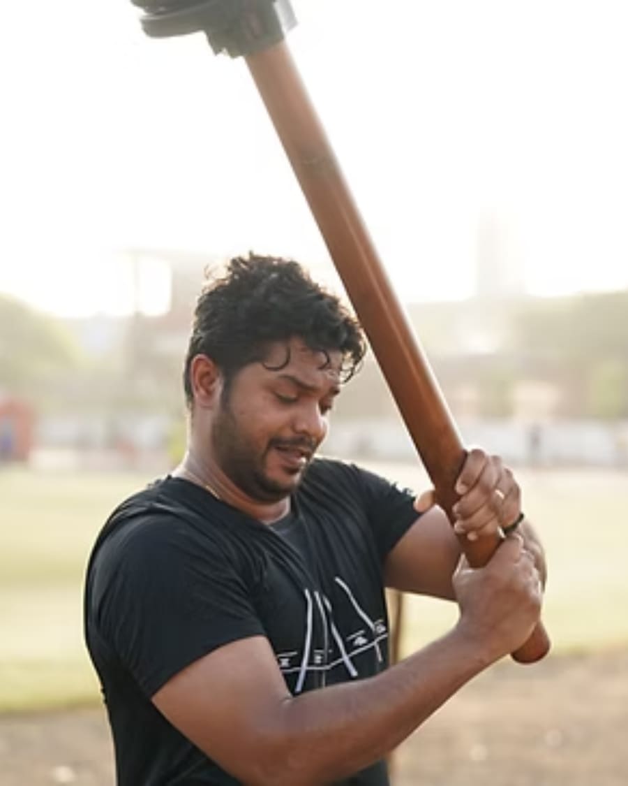 An athlete carrying the R.O.A.R mace at golden hour