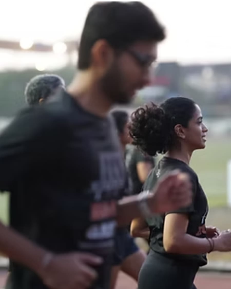 A motion-blurred candid shot of runners on the track