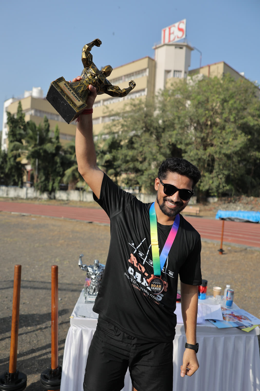 A finisher raising his R.O.A.R Games trophy