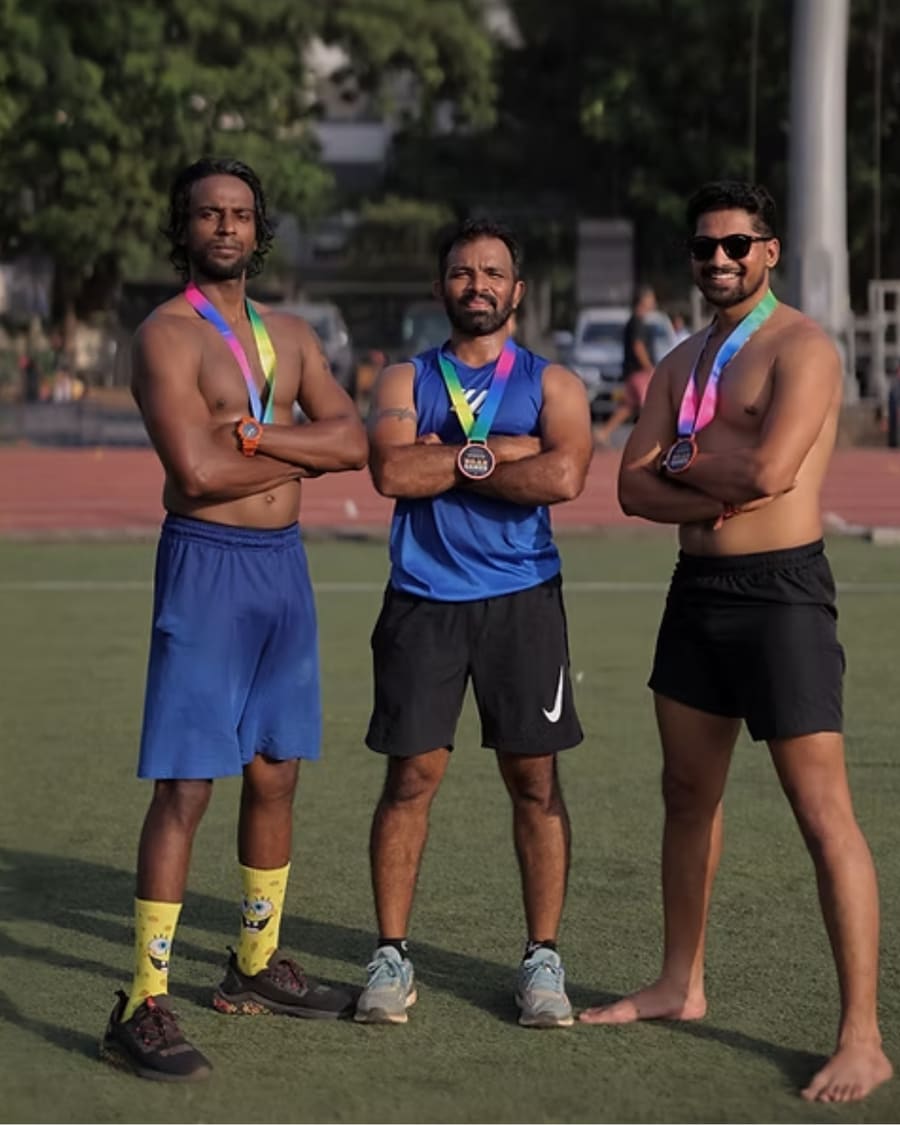 Three athletes posing with their R.O.A.R Games medals