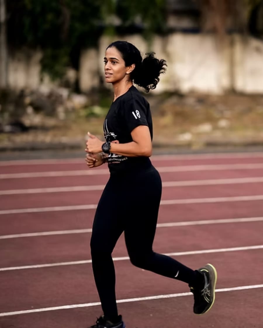 A woman running on the R.O.A.R Games track