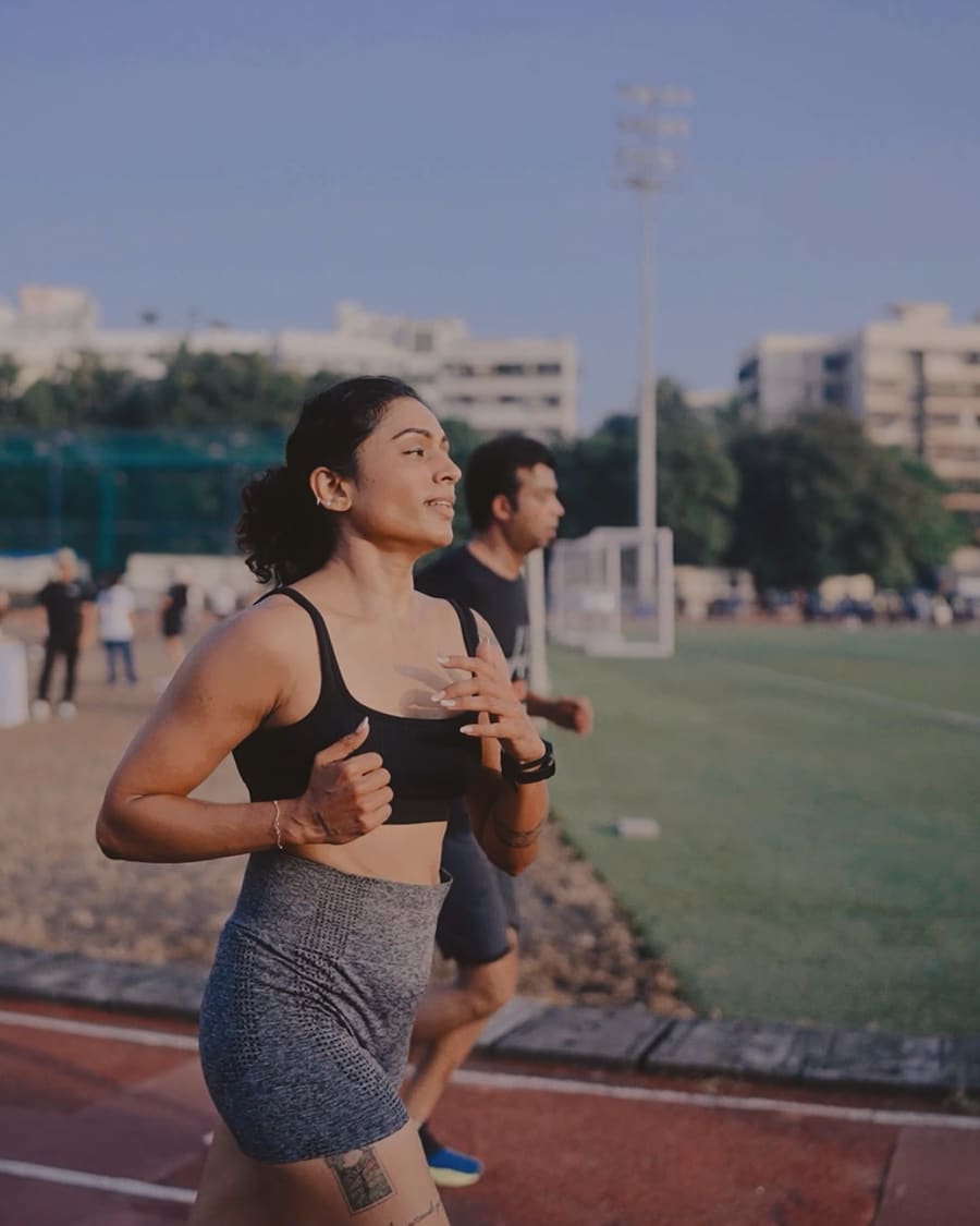 A woman running solo on the track